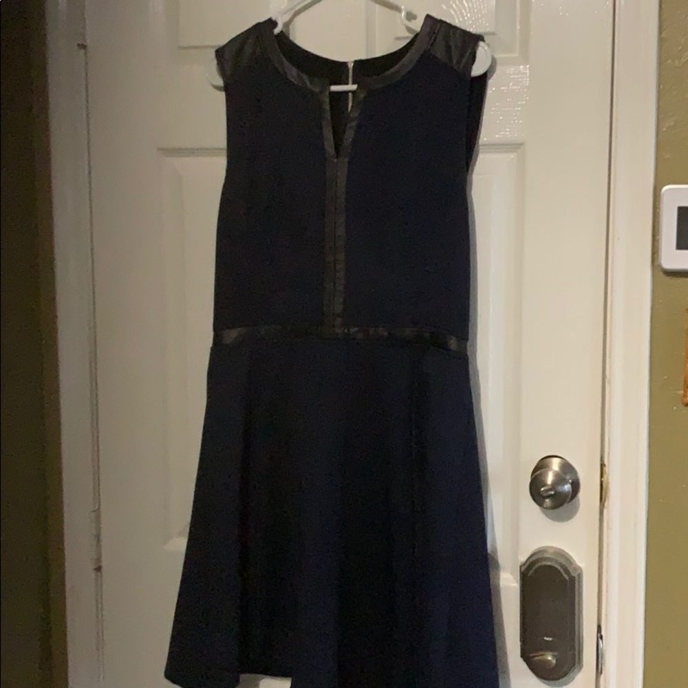 Dress dark blue, trimmed with black leather.